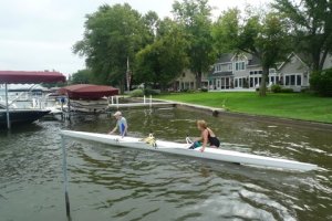 row boat in front of house